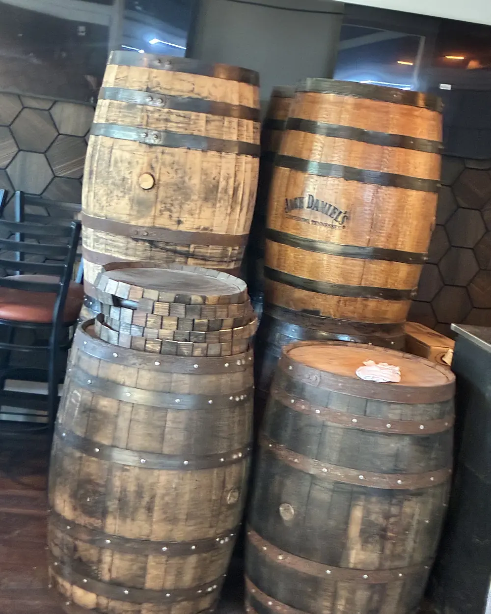 Oak whiskey barrels stacked next door at Barrel